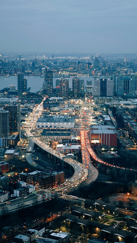 view of a busy city highways and boulevards overlooking a river